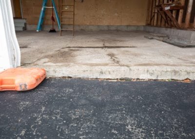 concrete garage floor needing repair