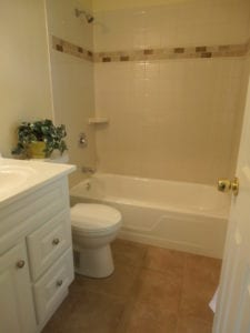 renovated bathroom with new tub and fixtures