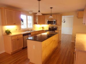 renovated kitchen with hardwood flooring