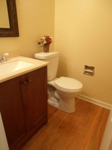 renovated bathroom with hardwood flooring