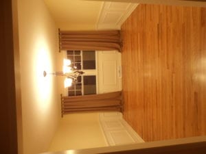completed home renovation - hallway with hardwood flooring